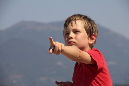 boy showing s th の写真素材