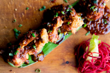 Fried pork with chili sauce on wooden plate, Thai style food