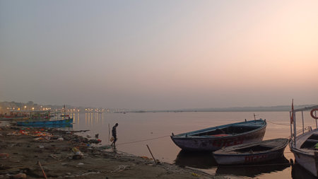 An image of many boats lined up at the ghats of Varanasi or Kashi in the early morningの写真素材