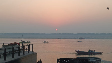 An image of many boats lines up i the ghats of varanasi or kashi in early morning