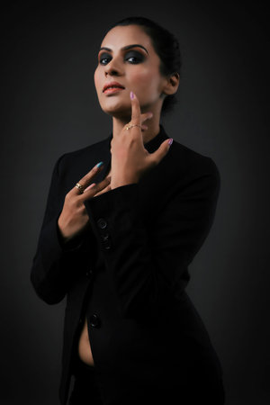 A stunning solo image of a tall female model in a classic black suit. The sleek lines and polished look emphasize the elegance, beauty, and versatility of formal monochrome attire.A tall and stunning female model posing in a stylish black suit. The image exudes professionalism and chic, making it ideal for showcasing modern formal fashion and elegance.A solo image of a beautiful tall female model dressed in a sharp black suit. Highlighting the balance of power and elegance, this photograph is perfect for themes of modern fashion and empowerment.の写真素材