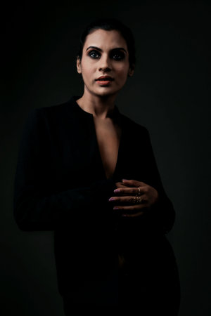 A stunning solo image of a tall female model in a classic black suit. The sleek lines and polished look emphasize the elegance, beauty, and versatility of formal monochrome attire.A tall and stunning female model posing in a stylish black suit. The image exudes professionalism and chic, making it ideal for showcasing modern formal fashion and elegance.A solo image of a beautiful tall female model dressed in a sharp black suit. Highlighting the balance of power and elegance, this photograph is perfect for themes of modern fashion and empowerment.の写真素材