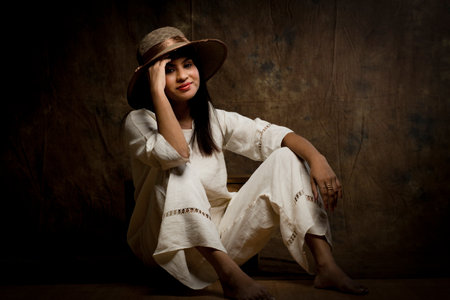 A stunning female model showcasing elegance in a pristine white linen shirt and trousers. A gorgeous woman posing confidently in an all-white ensemble, exuding beauty, sophistication, and style in her minimalist fashion look.A beautiful female model dressed in a stylish white linen shirt and trousers. Capturing the essence of grace and glamor, this image highlights the charm of a fashionable woman in an all-white attire, perfect for a modern and timeless aesthetic.A solo image of a gorgeous female model in a chic white linen shirt paired with matching trousers. The simplicity of the outfit enhances her natural beauty, creating a stunning portrait of elegance and contemporary style.の写真素材