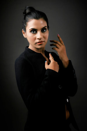 A stunning solo image of a tall female model in a classic black suit. The sleek lines and polished look emphasize the elegance, beauty, and versatility of formal monochrome attire.A tall and stunning female model posing in a stylish black suit. The image exudes professionalism and chic, making it ideal for showcasing modern formal fashion and elegance.A solo image of a beautiful tall female model dressed in a sharp black suit. Highlighting the balance of power and elegance, this photograph is perfect for themes of modern fashion and empowerment.の写真素材