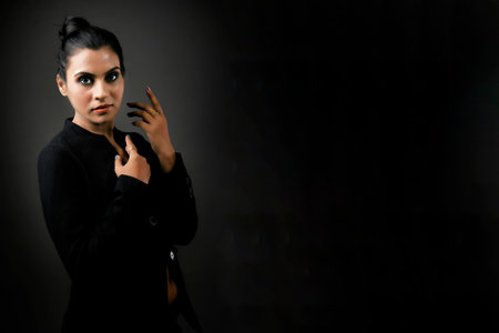 A stunning solo image of a tall female model in a classic black suit. The sleek lines and polished look emphasize the elegance, beauty, and versatility of formal monochrome attire.A tall and stunning female model posing in a stylish black suit. The image exudes professionalism and chic, making it ideal for showcasing modern formal fashion and elegance.A solo image of a beautiful tall female model dressed in a sharp black suit. Highlighting the balance of power and elegance, this photograph is perfect for themes of modern fashion and empowerment.の写真素材