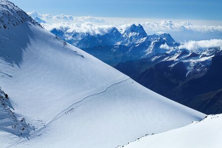 Climbers go on a slope of Elbrus.の写真素材