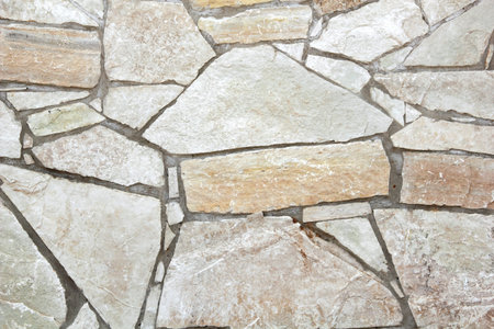 Masonry with white, yellow and grey bricks
