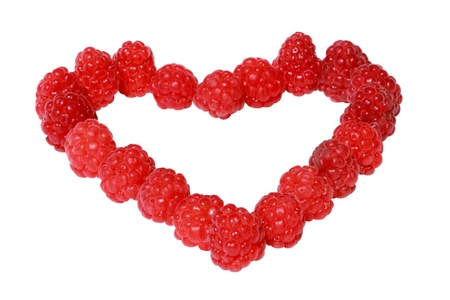 Heart made of raspberries isolated over white backgroundの写真素材