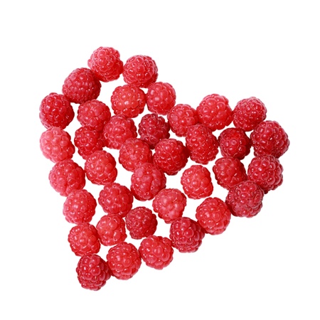Heart made of raspberries isolated over white backgroundの写真素材
