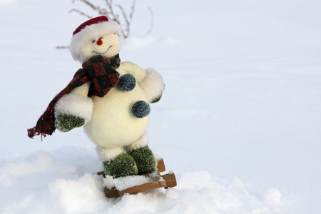 snow man snowboarder toy standing close upの写真素材