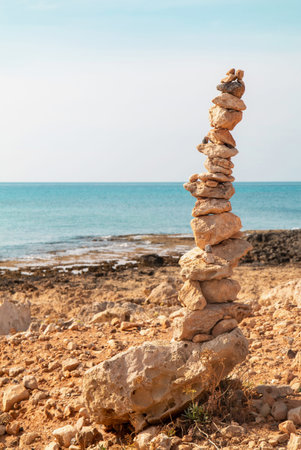 Stacked stones against the sea. Concept of harmony and balance