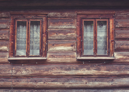 Close up of square  windows in old  wooden house