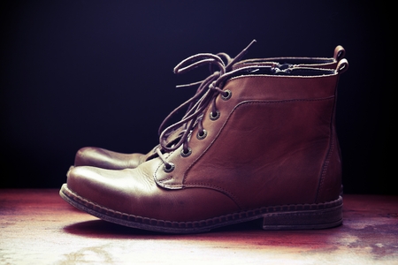 Brown leather shoes on  wooden floorの写真素材