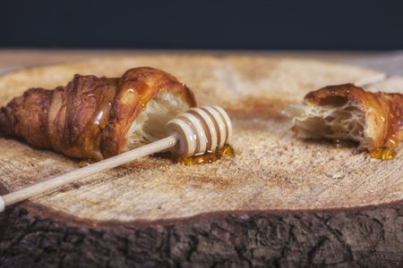 assortment of pastries with honey, raspberries and other - vintageの写真素材