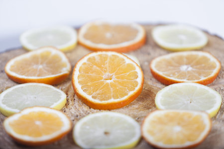 Vintage photo, Slices of  lemon and orange lying on old rustic wooden backgroundの写真素材