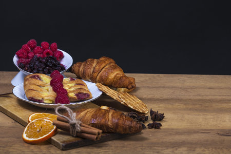 assortment of pastries with honey, raspberries and other - vintage