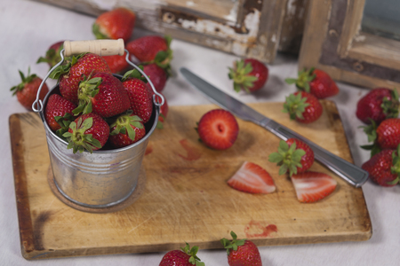Smoothies and fresh fruits on the tableの写真素材