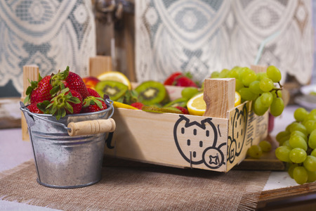 Smoothies and fresh fruits on the tableの写真素材