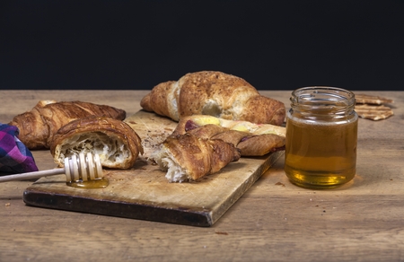 assortment of pastries with honey, raspberries and other - vintageの写真素材