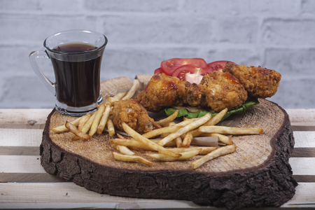 Fried chicken legs with french friesの写真素材