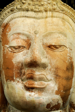 Close up ofan ancient stone Buddha.  の写真素材