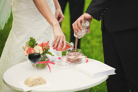 Wedding bride and groom with oversleeping sandの写真素材