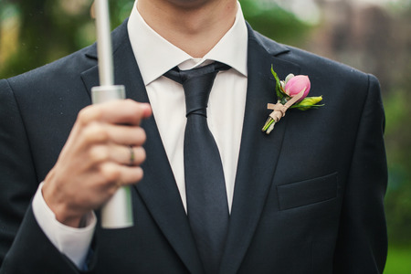 Very beautiful boutonniere on his jacket the groomの写真素材