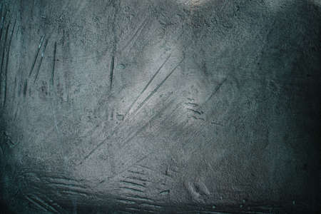 Background texture of a gray wall. The old wall of the building without repair with unique pattern, dots, scratches and brush strokes. Beautiful background for text, image, advertising a productの写真素材