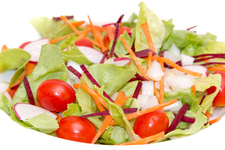 The fresh vegetable salad isolated on white backgroundの写真素材
