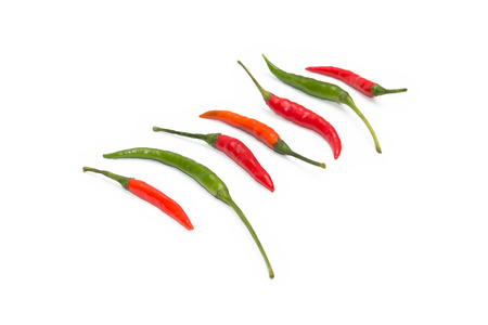 Red and green chilli peppers on the white backgroundの写真素材