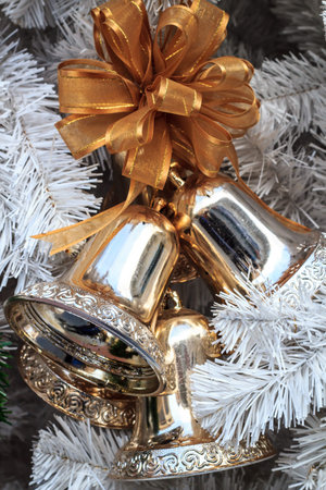 merry Christmas and happy new year,golden bells with a golden bow