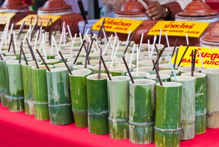 Traditional Thai bamboo tube for beverages in the market.のeditorial素材