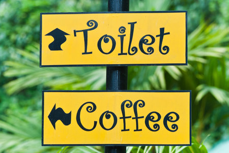 The signs of coffee shop and toilet in the park.の写真素材