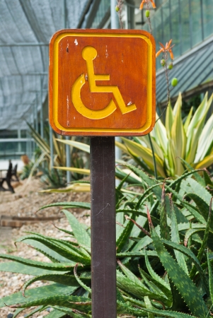 Parking sign for disable people in the gardenの写真素材