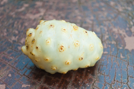 Noni fruits on Wooden tableの写真素材