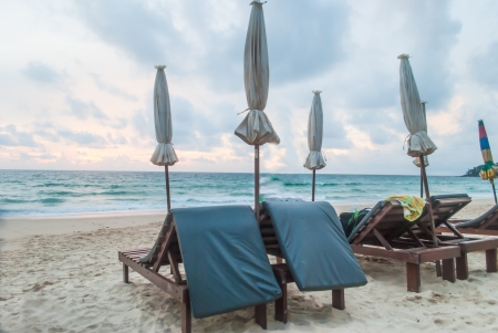 Chairs and umbrella on  tropical beach at Phuket island,Thailandの写真素材