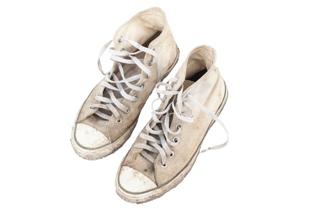 old sneakers on white background の写真素材