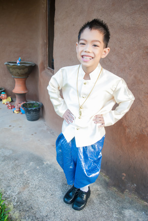 asian boy wearing national dress.の写真素材