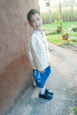 asian boy wearing national dress.の写真素材