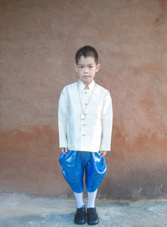 asian boy wearing national dress.の写真素材