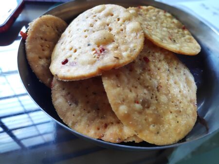 spicy fried mathri or mathari or papadi which is an indian regional snack for breakfast or Tea time.の写真素材