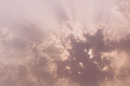 Sunrays emerging out of the cloudsの写真素材