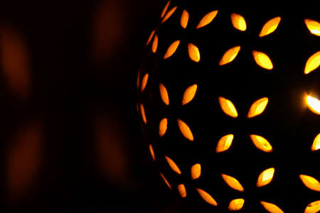 Halloween pumpkin light on black backgroundの写真素材
