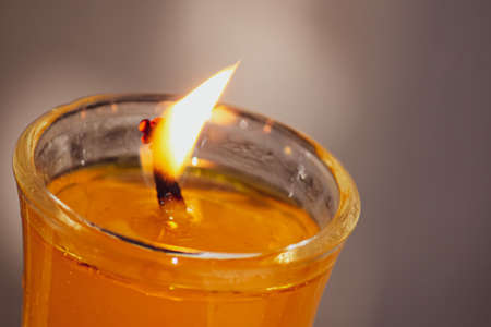 burning candle in a glassの写真素材