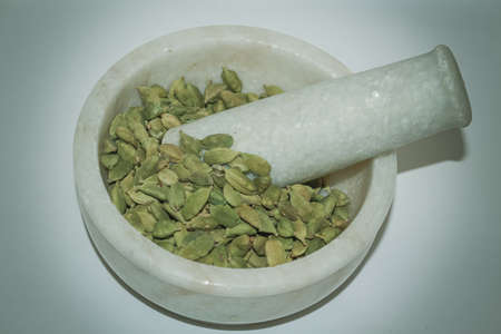 mortar and pestle with cardamomの写真素材