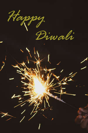 A happy diwali wish message with the sparkling of the crackersの写真素材