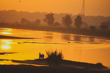 A beautiful sunset landscape over the riverの写真素材