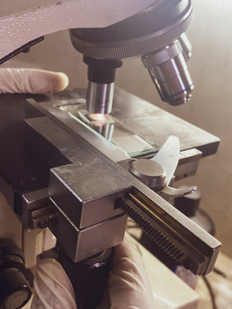 scientist (technician) working on a microscope in the laboratoryの写真素材