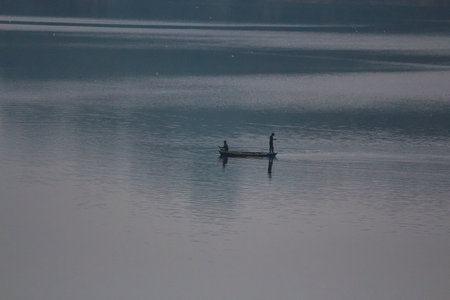 fishing on the boat in the eveningの写真素材