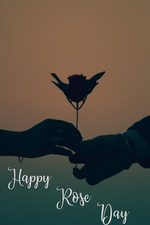 Illustration of Happy rose day with a silhouette of a couples hand with a rose valentine specialの写真素材
